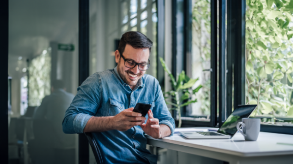 man-looking-at-phone-pay-periods