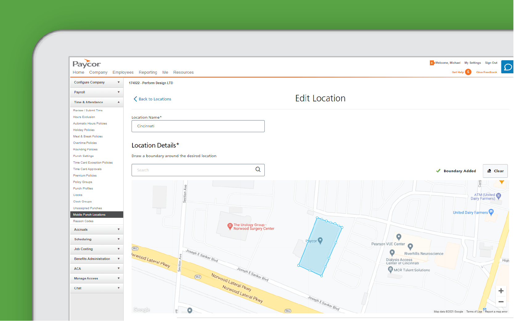 Corner of tablet showing Paycor geovalidation against green background