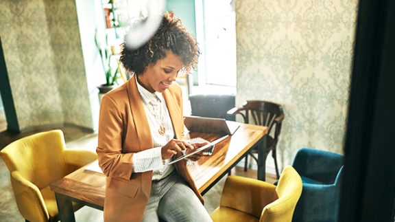 woman with tablet working on email policy