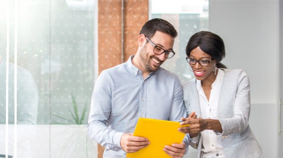 coworkers reviewing notes from shrm conference