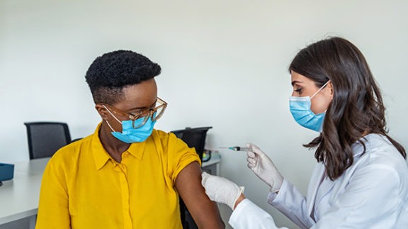 medical professional giving a vaccination