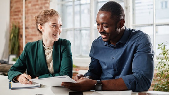 two people meeting looking at notes