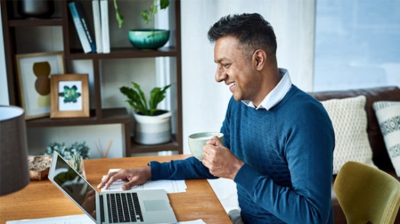 employee working in home office at laptop