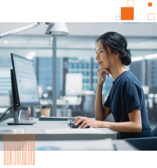 woman looking at chart on computer screen