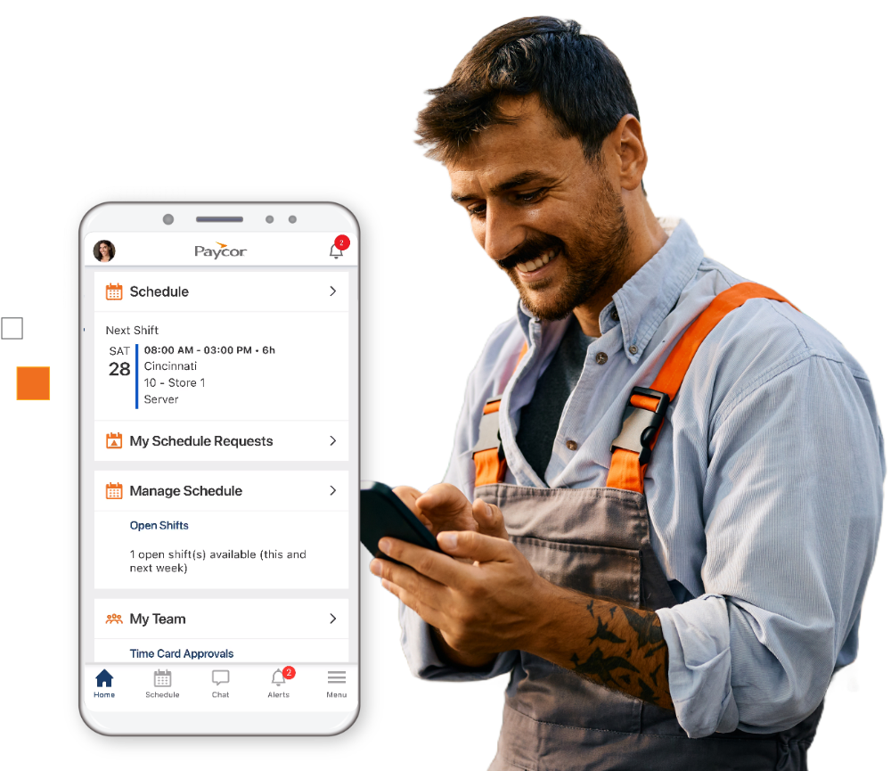 smiling industrial worker in apron touching smartphone