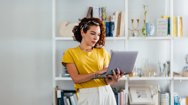 Gig worker holding laptop in hand